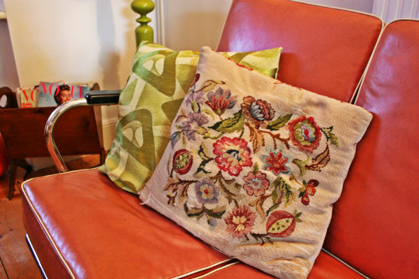 1940's tapestry cushion on our 1950's vinyl sofa